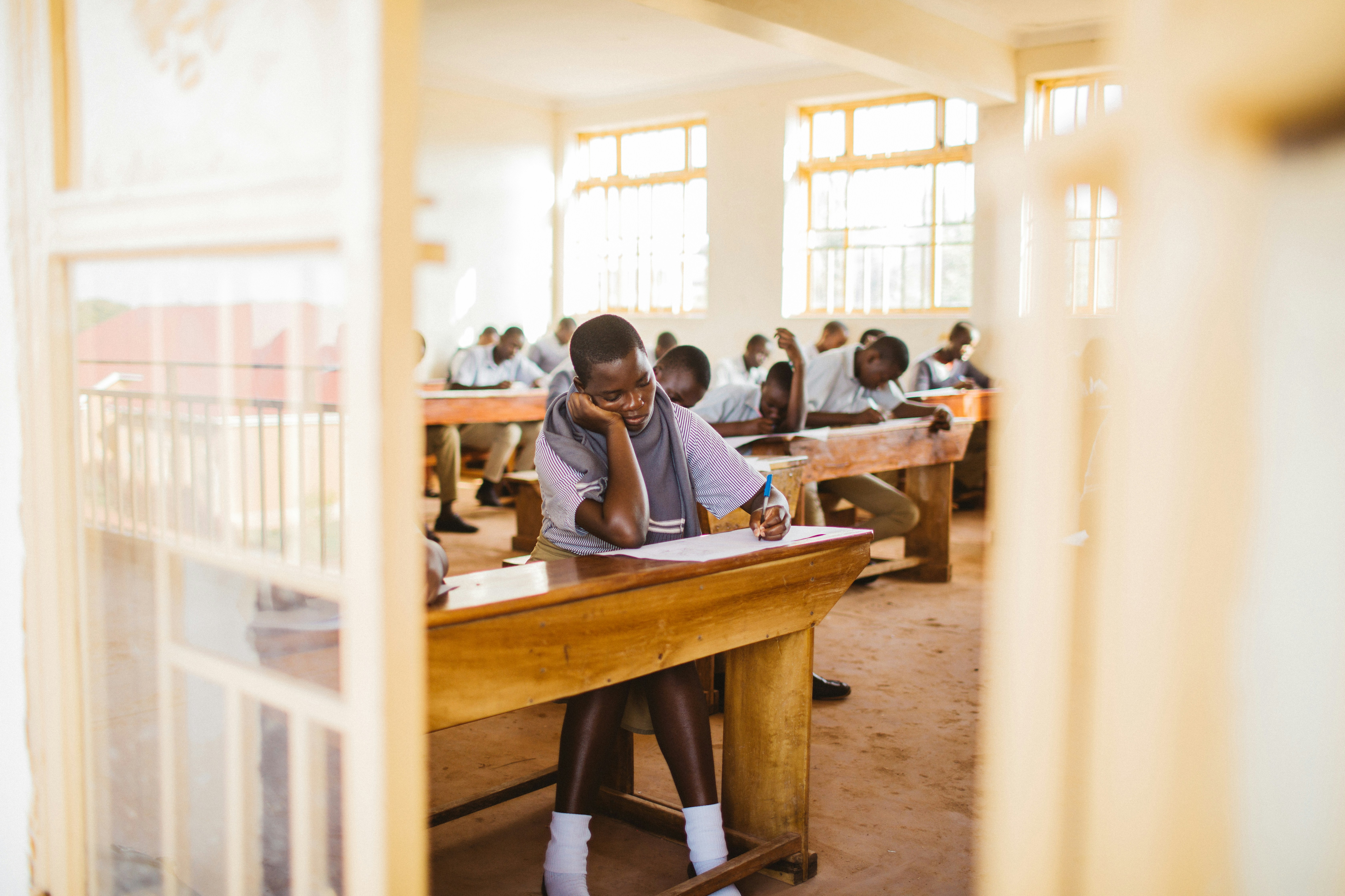 Students learning in a rural school classroom in Iganga, Uganda